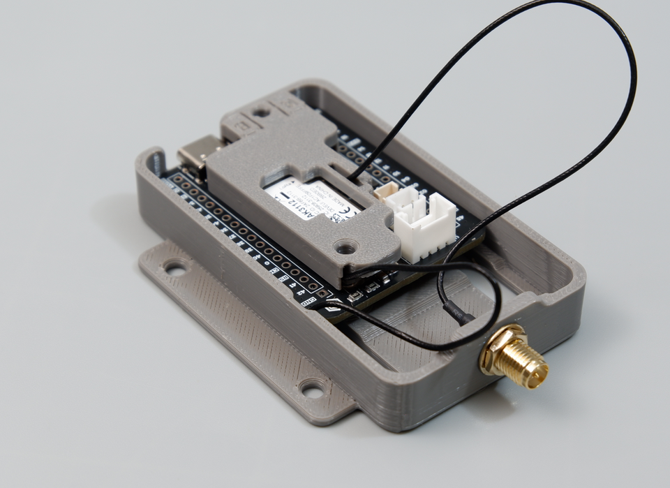 Aligning the antenna locker plate flat over the module with Wi-Fi cable routed through the rear slit