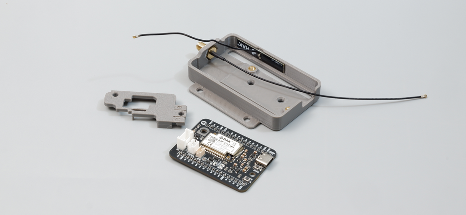 Disassembled view of the Cubicore Devboard, baseplate, and antenna locker plate