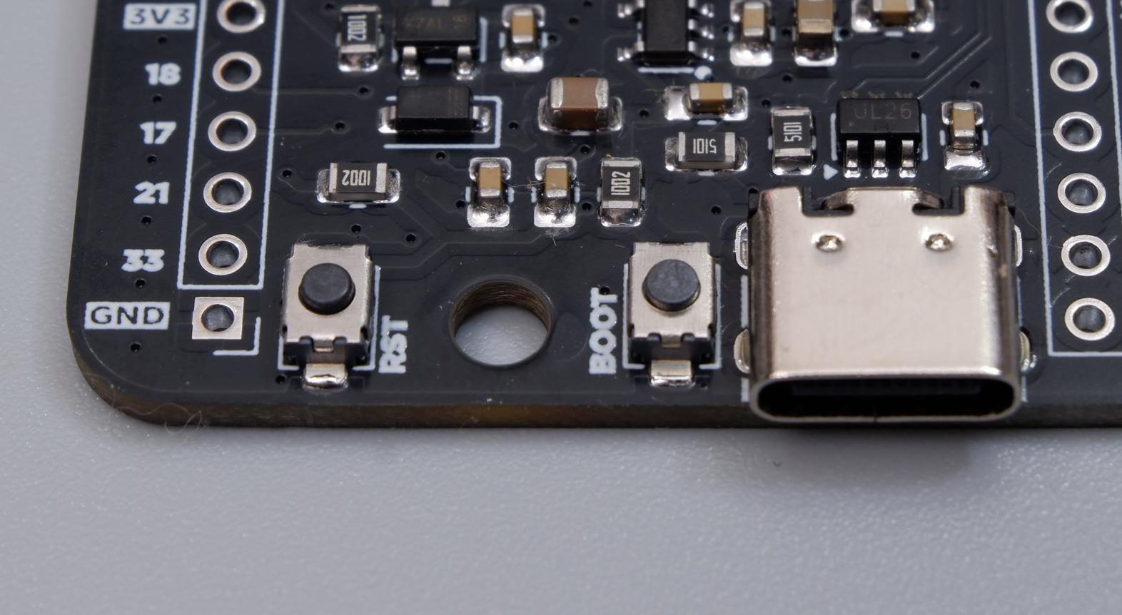Close-up of the USB Type-C connector, BOOT button, and RST button on the bare Cubicore Devboard