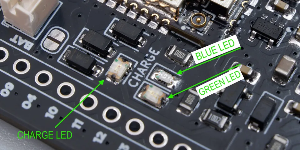 The three onboard LEDs on the Cubicore Devboard — blue status, green status, and charge LED