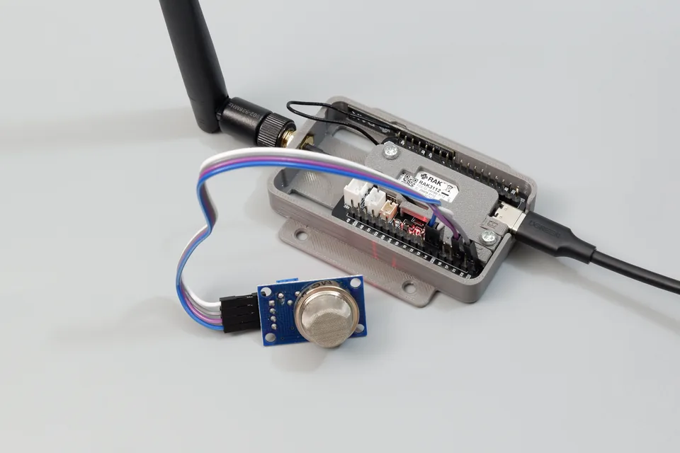 Cubicore Devboard in enclosure connected to an MQ-2 gas and smoke sensor module
