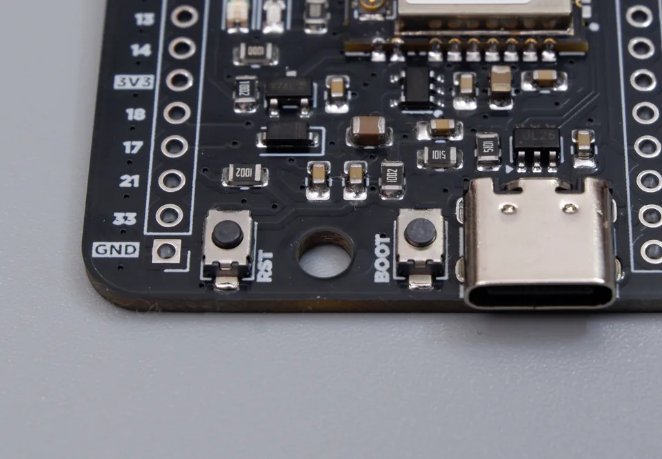 Close-up of the USB Type-C connector, BOOT button, and RST button on the bare Cubicore Devboard